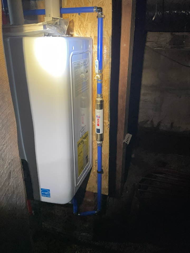Energy Star tankless water heater with PEX supply lines in a utility space