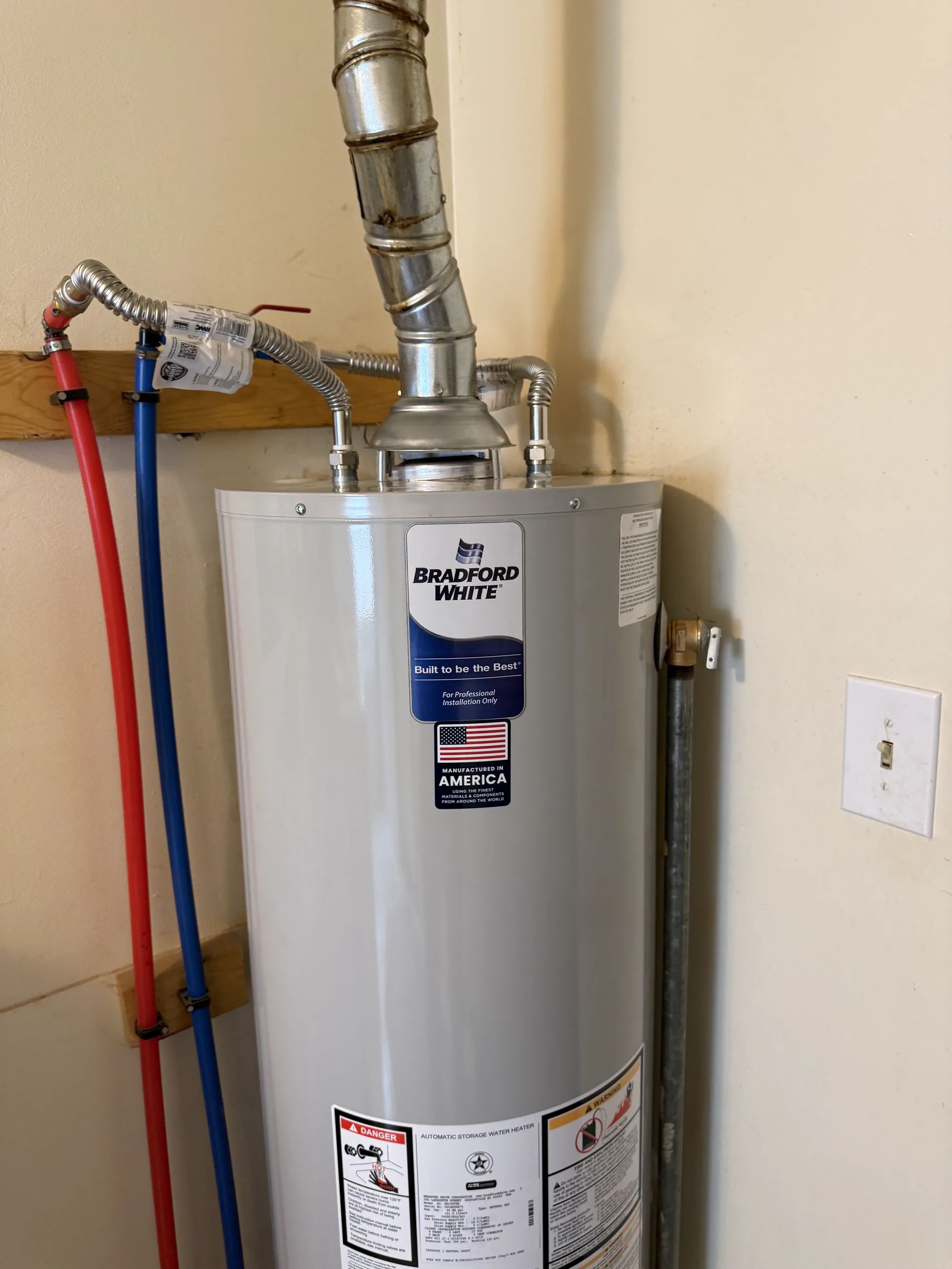 Bradford White water heater install with galvanized vent pipe and PEX supply lines
